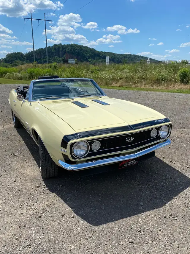 A pale yellow 1967 Camaro SS 350 convertible
